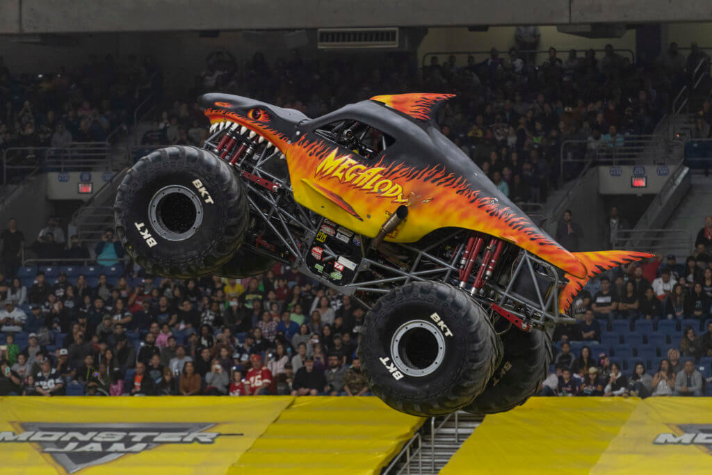 Megalodon Fire Monster Jam Truck in Air