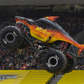 Megalodon Fire Monster Jam Truck in Air