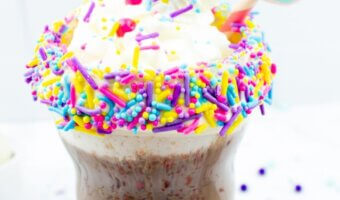 Hot chocolate bombs with sprinkles and a Unicorn straw