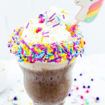 Hot chocolate bombs with sprinkles and a Unicorn straw